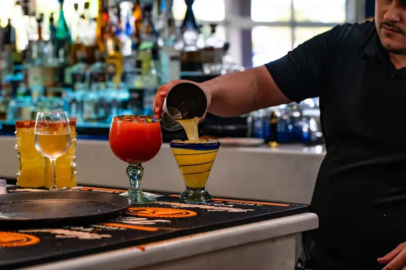 Margaritas poured at the bar at Viva Leawood