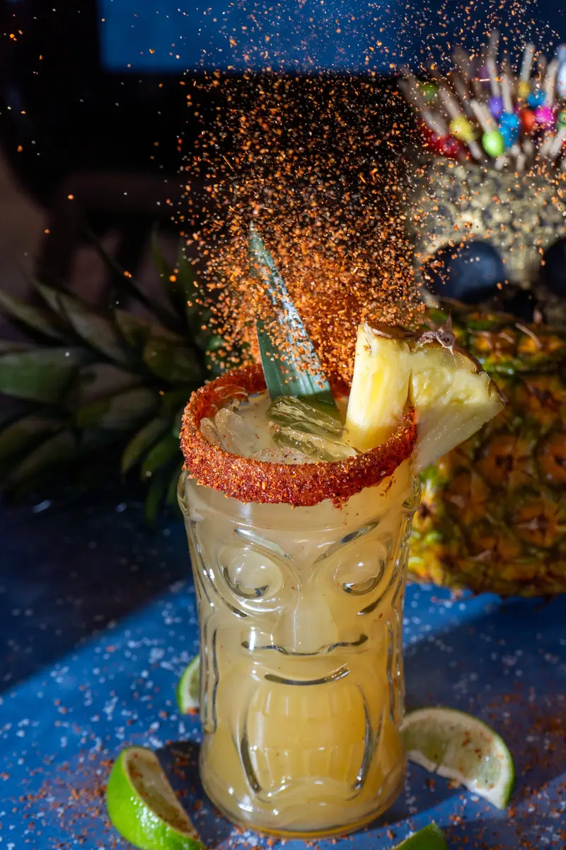 A tiki cocktail with a sparkler at Viva Olathe