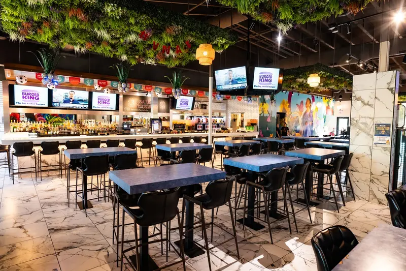 Dining room under hanging greenery at Viva Olathe