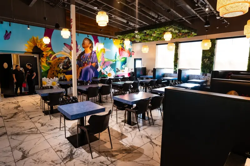 Dining room with murals at Viva Olathe