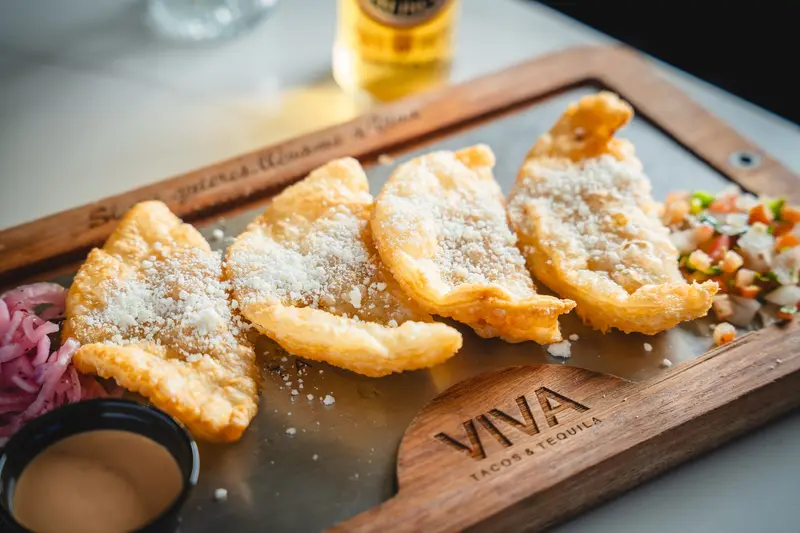 Empanadas on a VIVA board at Viva Wichita